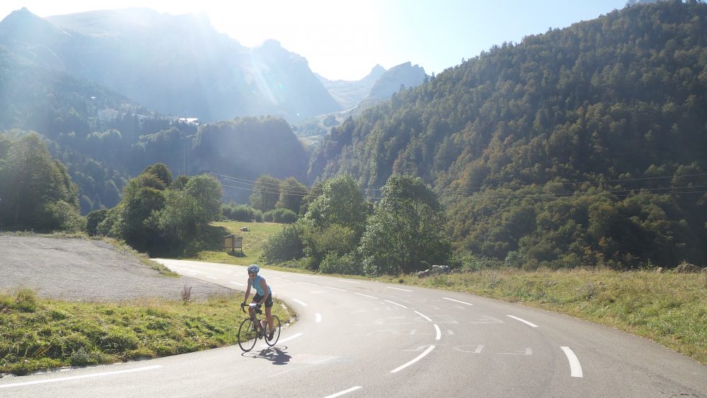 Cyclist on Tour de France climb of Col de Pailheres on the Raid Pyrenean road cycling challenge