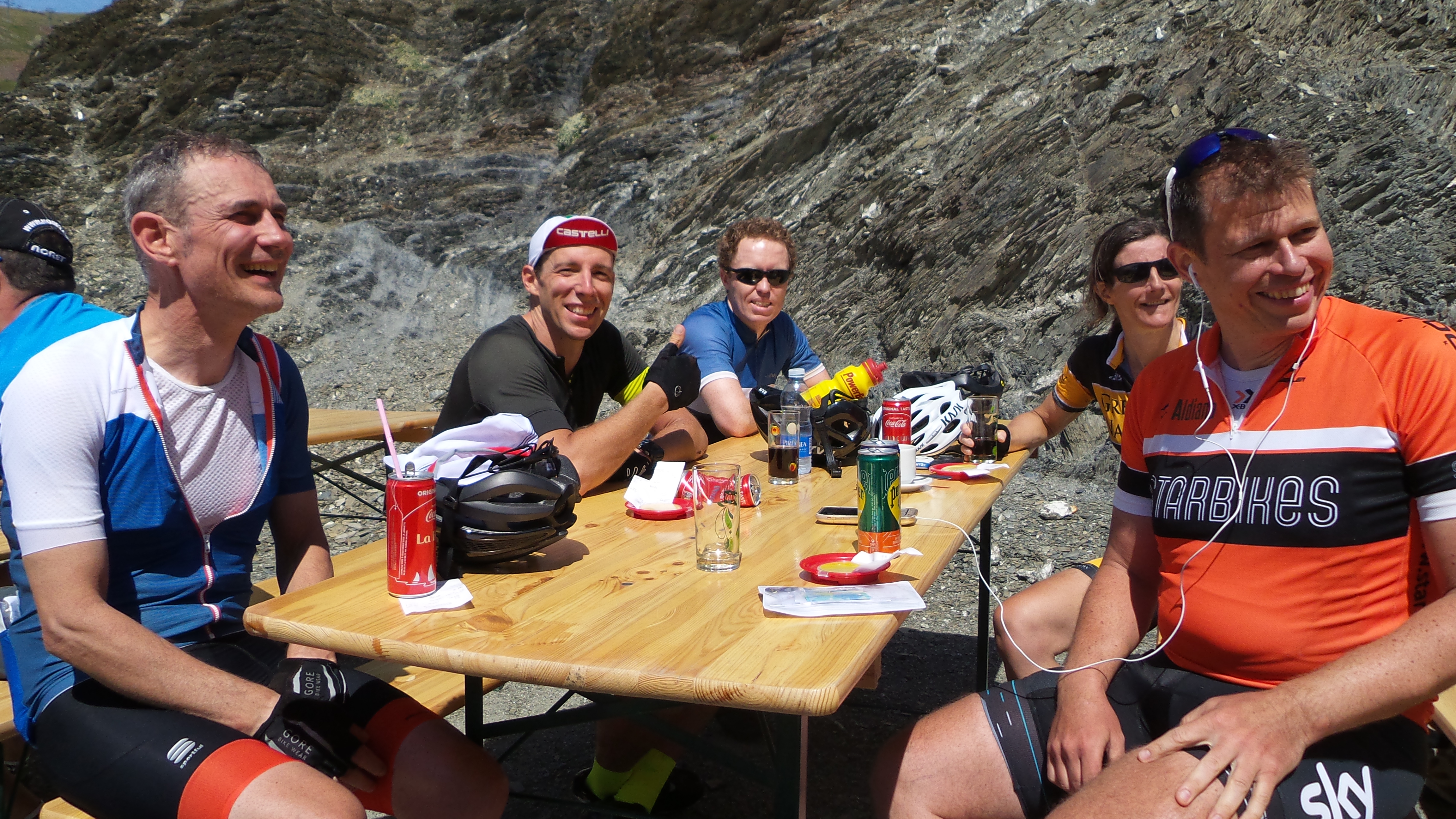 A group of riders relax at a cafe in the Picos on a Marmot Tours road cycling holiday.