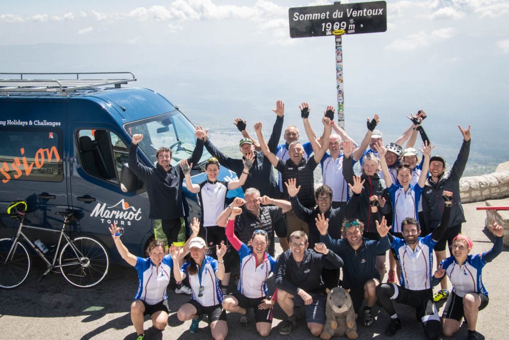 The full Marmot Tours team celebrate atop the mighty Mont Ventoux in Provence