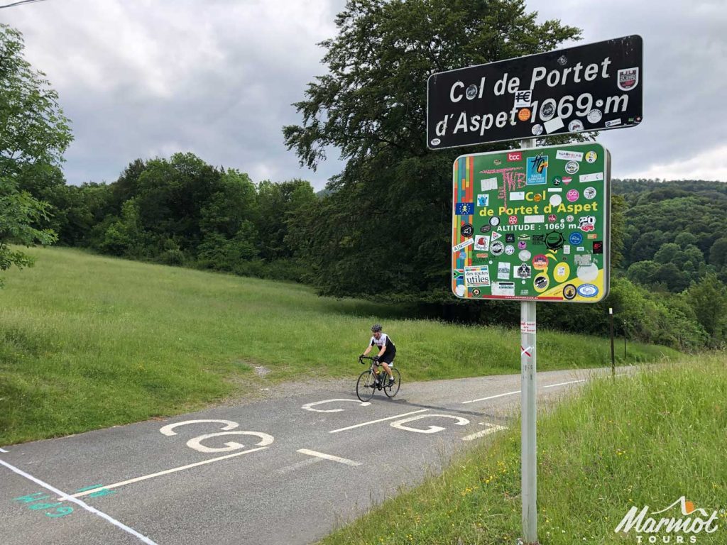 Cyclist on Col de Portet d'Aspet Raid Pyrenean cycling challenge Marmot Tours