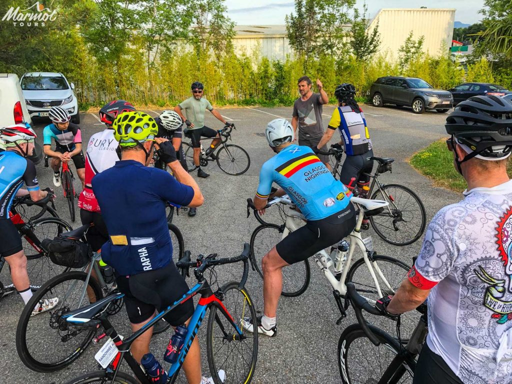 Marmot Tours road cycling holiday guide giving a daily briefing to a group of cyclists