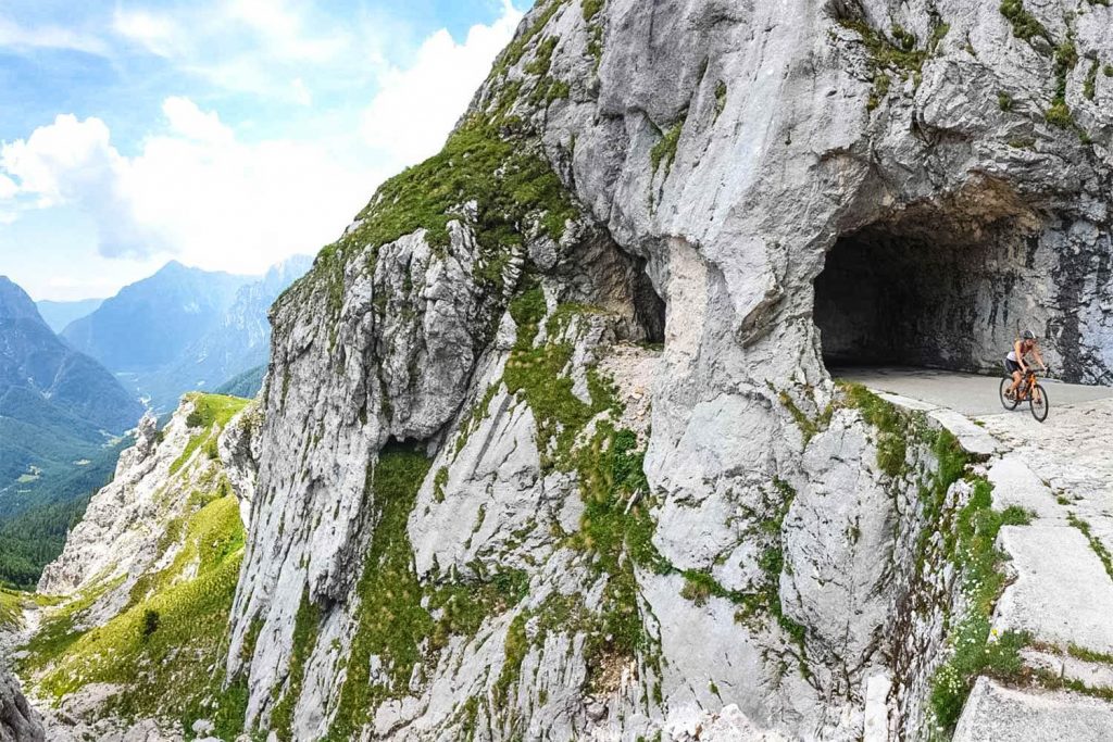 Cyclist in tunnel on Mangart Pass on Marmot Tours road cycling holidays Slovenia and Zoncolan