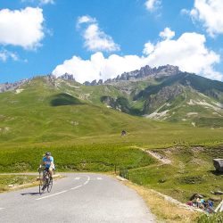 Two cyclists enjoying the Alps on Tour de France road cycling holiday Marmot with Tours