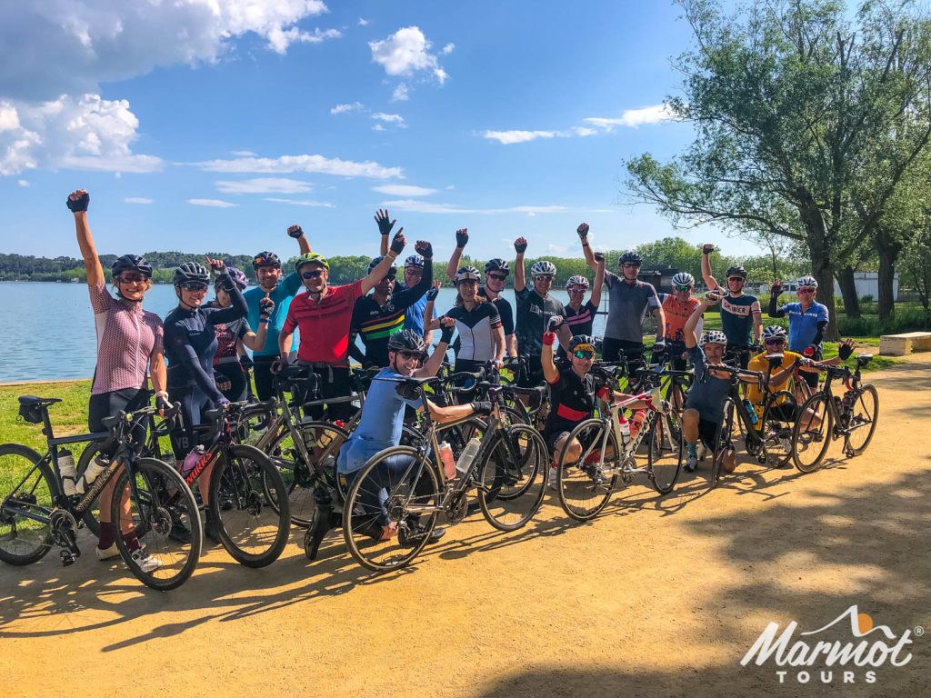 Group of cyclists cheering on Marmot Tours fully supported road cycling holiday in Catalonia