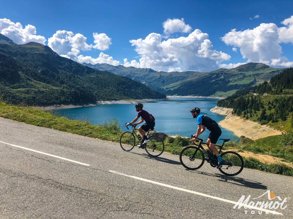 Pair of cyclists climbing Cormet de Roselend in French Alps on Marmot Tours fully supported road cycling holiday challenge