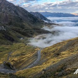 Col du Tourmalet valley shrouded in clouds on guided road cycling holiday in Pyrenees with Marmot Tours