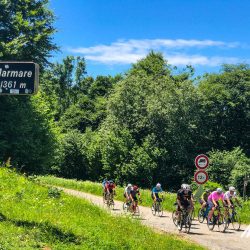 Group of cyclists at Col de Marmare on Raid Pyrenean with Marmot Tours road cycling holidays in Pyrenees France