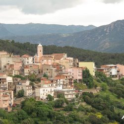 Village hamlet on mountainside on road cycling tour of Sardinia with Marmot Tours