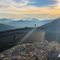 Cyclist at sunrise on hairpin bend near summit Mont Ventoux with Marmot Tours