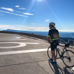 Cyclist at summit of Mont Ventoux with Marmot Tours guided road cycling holidays