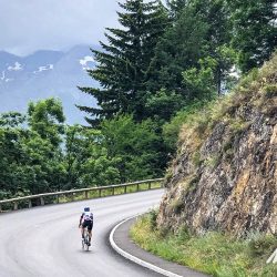 Cyclist climbing Alpe d'Huez on Marmot Tours guided cycling tour of French Alps