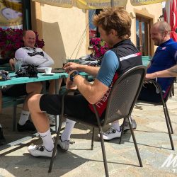 Cyclists enjoying cafe break on Marmot Tours guided road cycling tour of Dolomites Italy