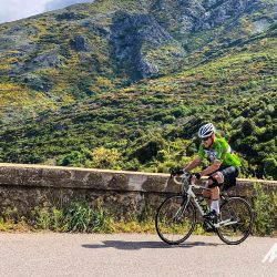 Cyclist climbing on Marmot Tours supported cycling holiday of Corsica