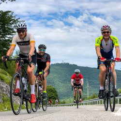 Group of cyclists climbing in Triglav National Park Slovenia on guided road cycling holiday with Marmot Tours