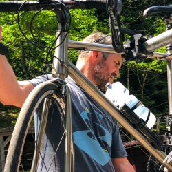 Marmot Tours road cycling holiday guide Tim doing bike maintenance