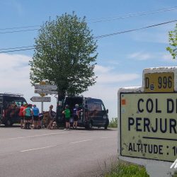 Group of cyclists and Marmot Tours support vehicle on Col de Perjuret guided cycling holiday south of France Cevennes and Ardeche