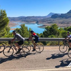 Cyclists and dam on Marmot Tours guided group cycling holiday Andalusia Spain