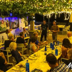 Cyclists at dinner briefing on Marmot Tours fully supported road cycling tour of Andalusia Spain