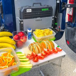 Table of colourful fresh fruit and snackson Marmot Tours Raid Alpine cycling challenge French Alps