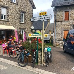Cyclists enjoying cafe break on Marmot Tours Raid Massif Central French cycling holidays