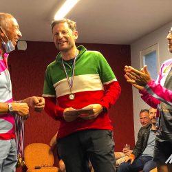 Cyclist receiving medal and certificate for Raid Massif Central with marmot Tours French cycling holidays