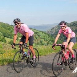 Pair of cyclist enjoying open roads in moorland on Marmot Tours Raid Massif Central French cycling holidays