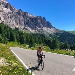 Smiling cyclist in Dolomites Italy on Marmot Tours guided road cycling holiday