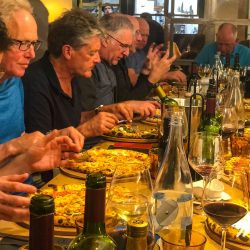 Group of cyclists enjoying dinner on Marmot Tours guided road cycling tour Girona Catalonia Spain