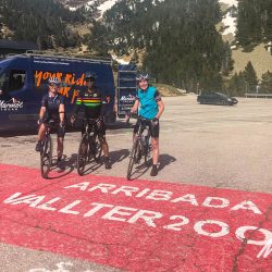 Cyclists at summit of Vallter 2000 Vuelta d'Espana climb with Marmot Tours fully supported guided road cycling holiday Girona cycling tour Catalonia Spain