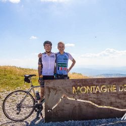 Pair of cyclists posing at Monragne de Lure on Marmot Tours guided road cycling holiday Mont Ventoux