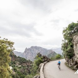 Cyclist climbing Col de Bavella Bocca di Bavedda on Raid Corsica with Marmot Tours