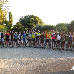 Group of cyclists preparing to start day 1 of Raid Corsica with Marmot Tours road cycling holidays
