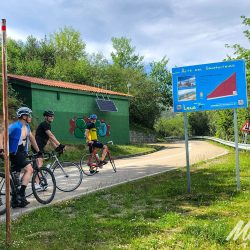 Group of cyclists pause at Gamoniteiro cycling climb Picos de Europa with Marmot Tours road cycling holidays