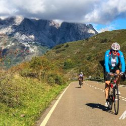Cyclists enjoying a sunny climb in Picos de Europa Northern Spain with marmot Tours road cycling holidays and challenges