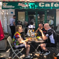 Cyclists enjoying lunch in French cafe on Marmot Tours guided road cycling tour Mont Ventoux Verdon Gorge France