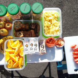 Table of fresh fruit, nuts and snacks for cyclists on Marmot Tours fully supported road cycling tour of Southern Alps