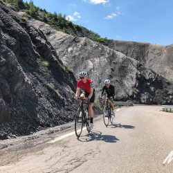 Pair of cyclists enjoying climbing in Southern Alps with Marmot Tours