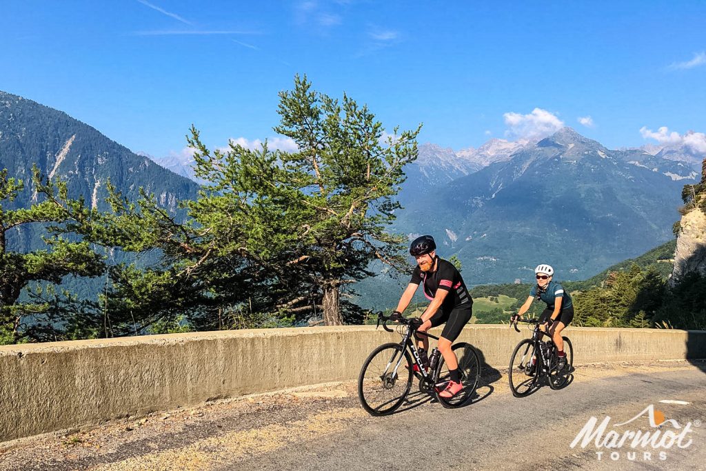 Pair of cyclists enjoying Alpine cycling climb on Marmot Tours guided road cycling holiday in the Alps