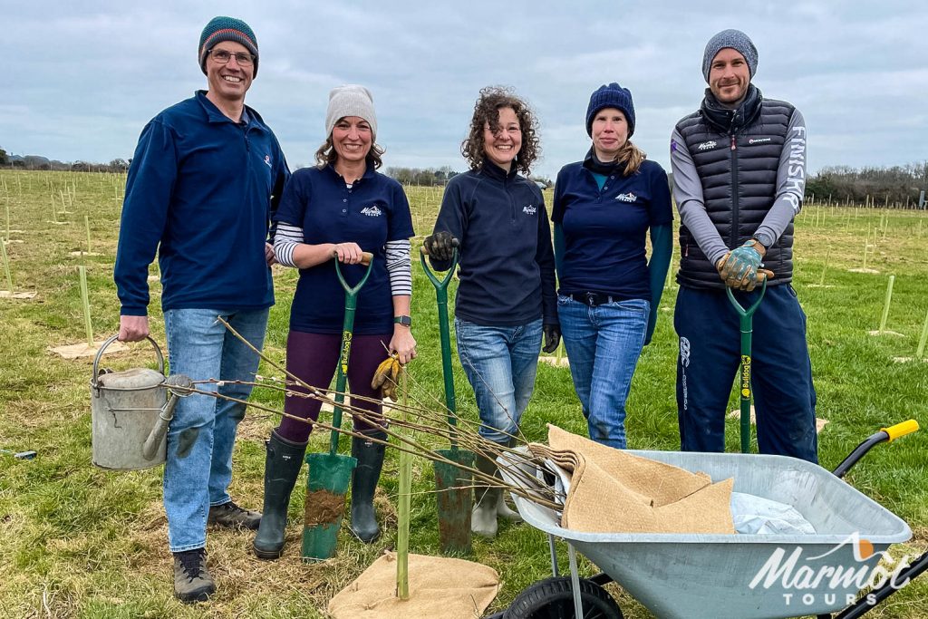 Marmot Tours team tree planting for Avon Needs Trees charity