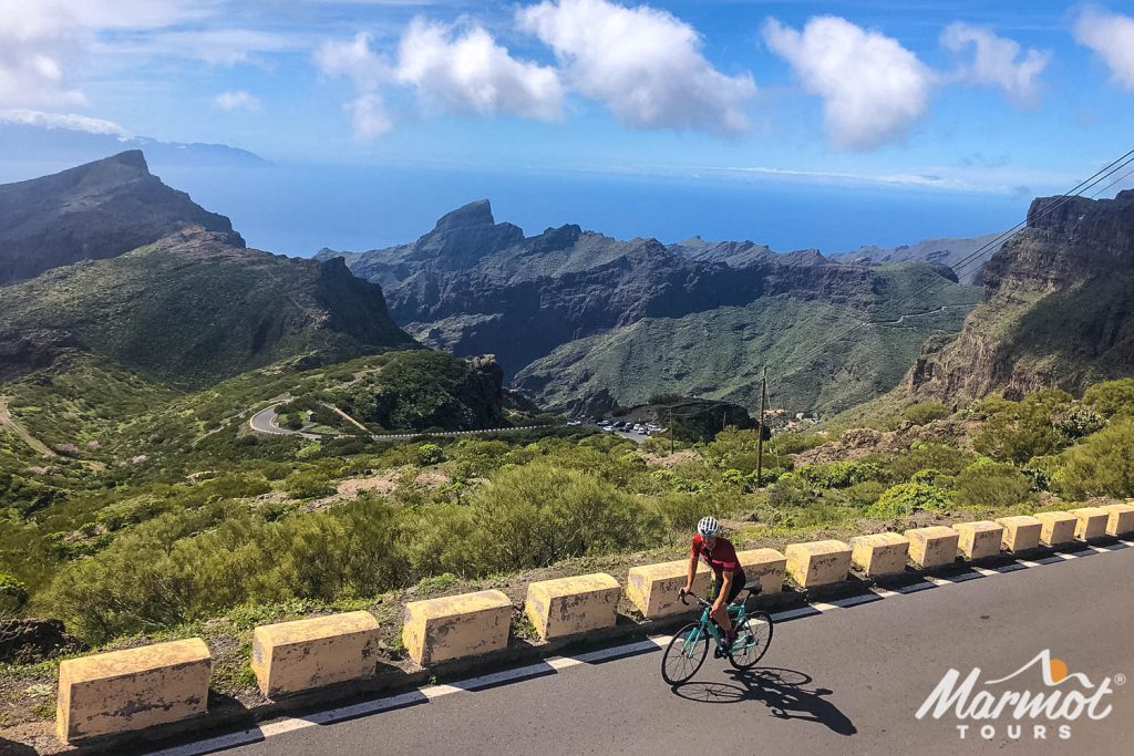 Cyclist climbing with sea in background on Marmot Tours guided cycling holiday in Tenerife