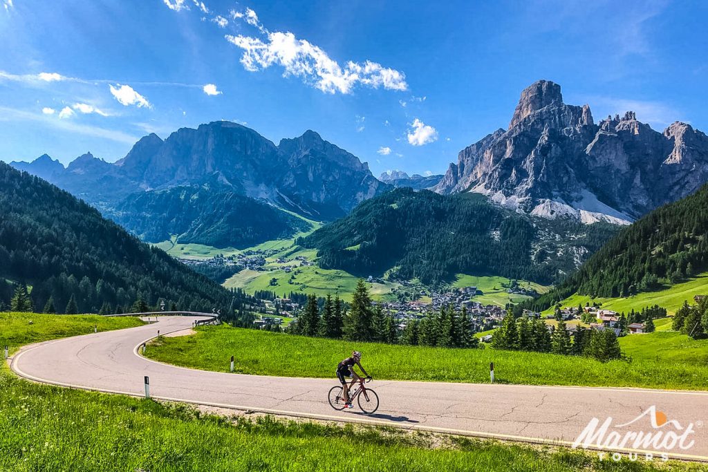 Cyclist riding in Dolomites mountain range with Marmot Tours road cycling holidays
