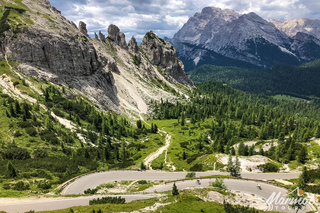 Pair of cyclist descend hairpins of Stelvio on Marmot Tours guided road cycling holiday Dolomites