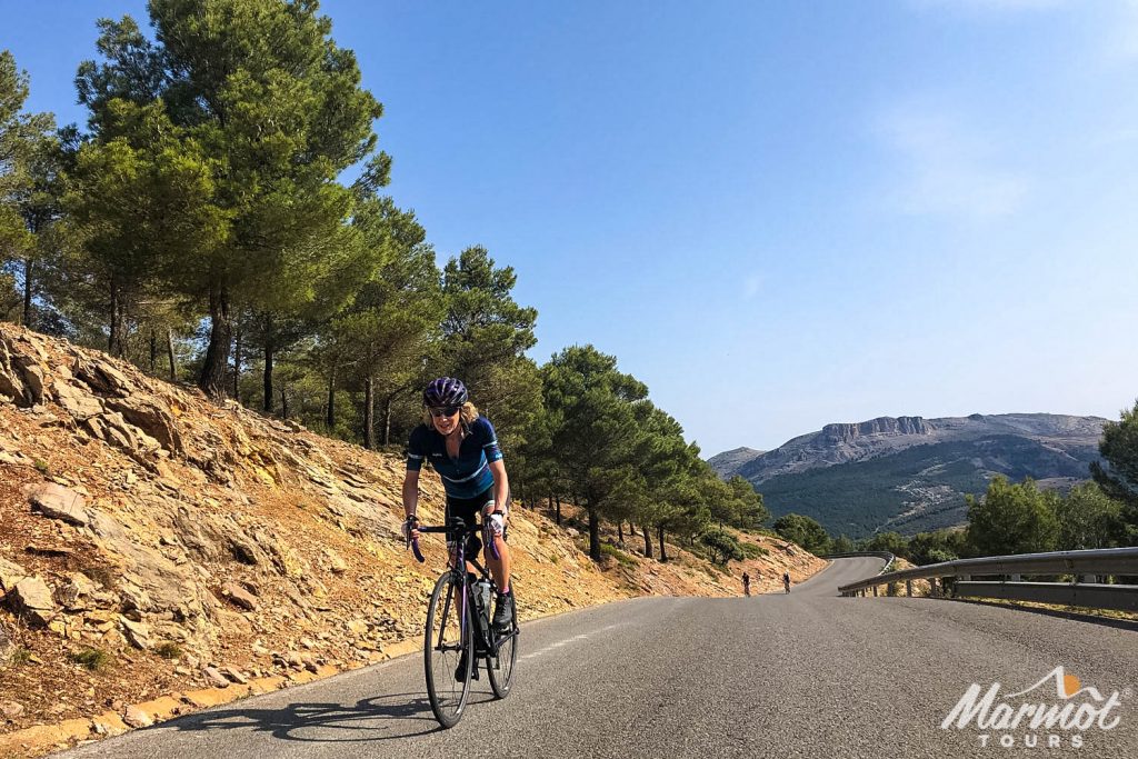 Cyclist enjoying sunny climb in Andalusia with Marmot Tours road cycling holidays