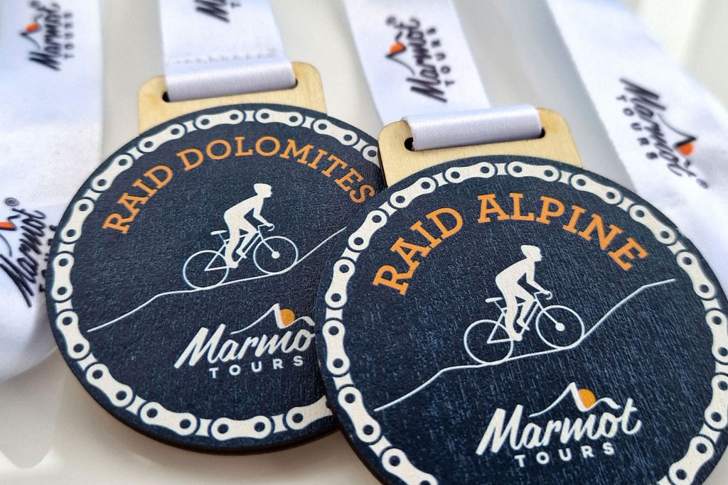 Marmot Tours sustainable medals for Raid Alpine and Raid Dolomites road cycling challenges