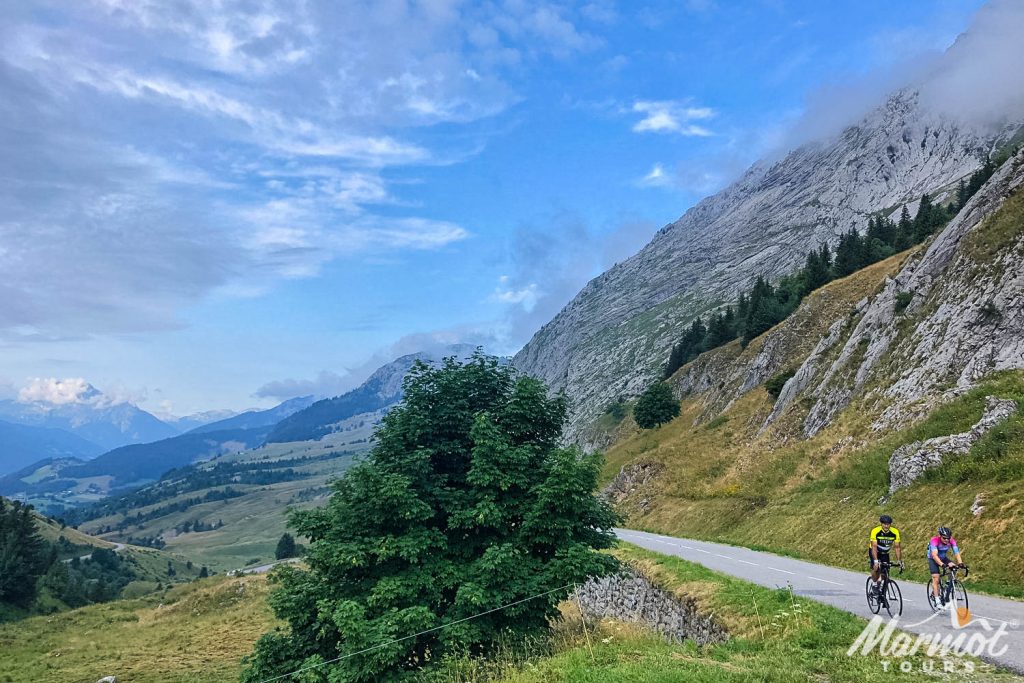 Pair of cyclists on Col de la Colombiere climb with Marmot Tours guided road cycling tour French Alps