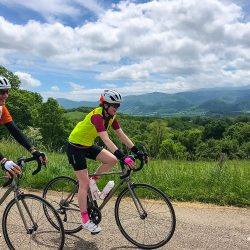 Pair of cyclists on guided group cycling tour foothills pyrenees with marmot tours