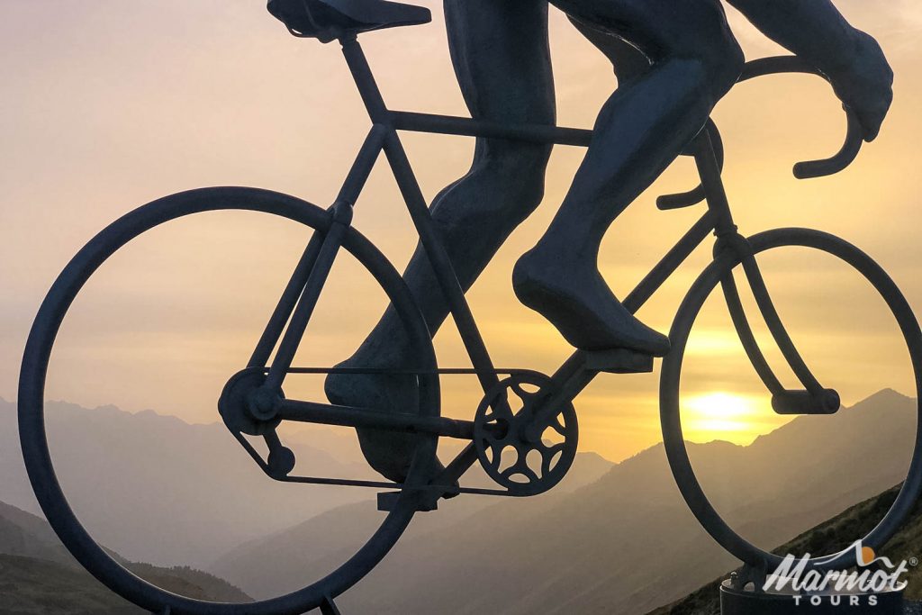 Col du Tourmalet sculpture whiz outline of mountains at sunset on Marmot Tours guided road cycling holiday in Pyrenees