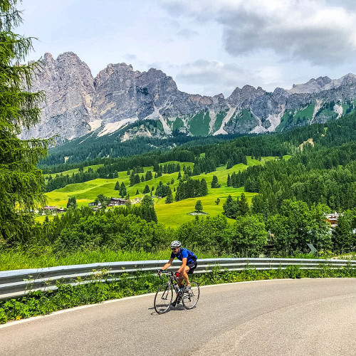 cyclist enjoying mountain pass in Italian Dolomites on marmot tours guided road cycling holiday