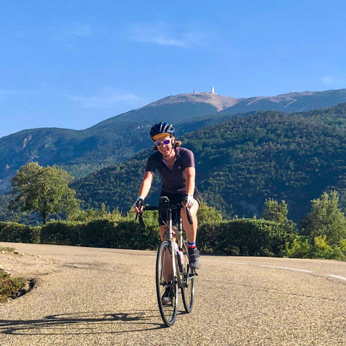 Female cyclist with Mont Ventoux in background on full support cycling holiday Provence with Marmot Tours