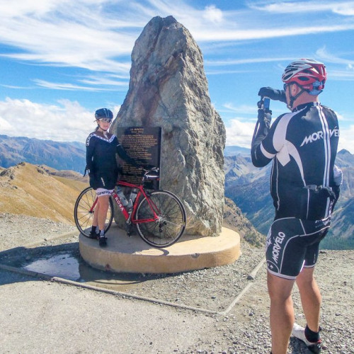 Female cyclist posing for photo at Col de la Bonette Southern Alps road cycling tour with Marmot Tours